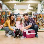 dog with family in pet store